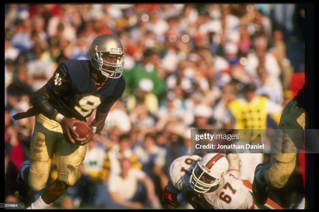 Tony Rice of the Notre Dame Fighting Irish runs with the ball during ...