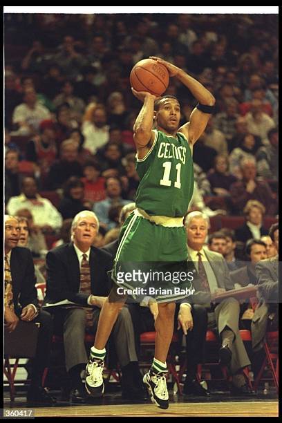 Guard Dana Barros of the Boston Celtics prepares to shoot the ball during a game against the Chicago Bulls at the United Center in Chicago, Illinois....