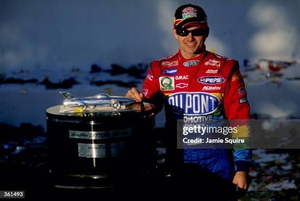 Jeff Gordon poses with the trophy after winning the NASCAR Daytona 500 at the Daytona International Speedway in Daytona, Florida. Mandatory Credit:...