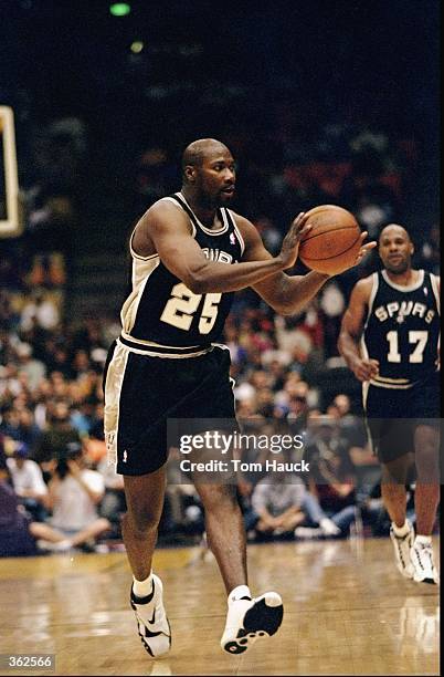 Jerome Kearsy of the San Antonio Spurs passes the ball during the game against the Los Angeles Lakers at the Great Western Forum in Inglewood,...