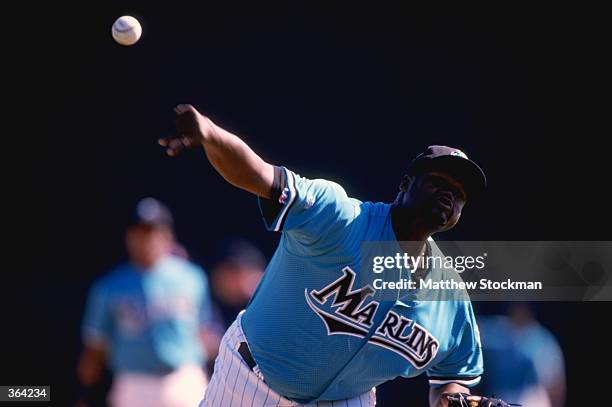 Pitcher Antonio Alfonseca of the Florida Marlins throws during a Spring Training game against the Houston Astros at the Space Coast Stadium in...