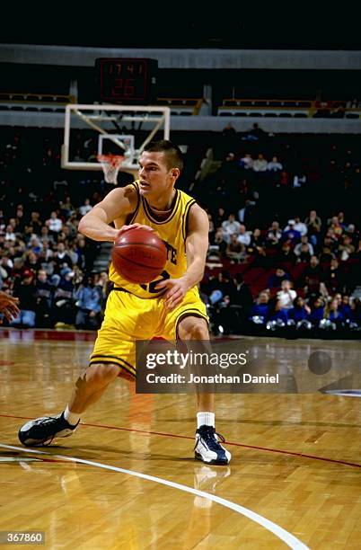 Brian Wardle of the Marquette Golden Eagles passes during the game against the DePaul Blue Demons at the United Center in Chicago, Illinois. The Blue...