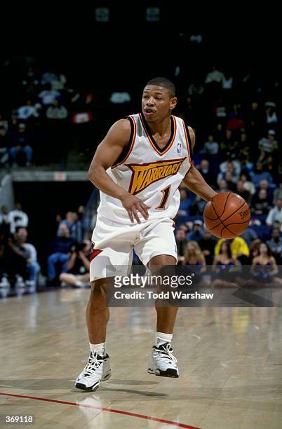 Tyrone Bogues of the Golden State Warriors in action during the game against the Minnesota Timberwolves at the Oakland Arena in Oakland, California....
