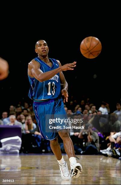 Bobby Phills of the Charlotte Hornets passes the ball during the game against the Los Angeles Lakers at the Great Western Forum in Inglewood,...