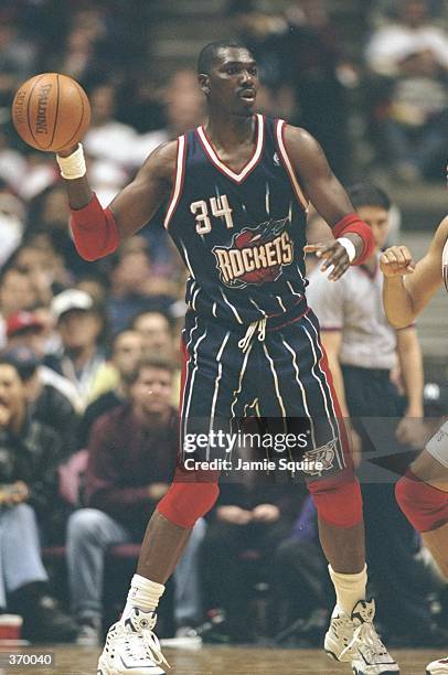 Hakeem Olajuwon of the Houston Rockets in action during the game against the New Jersey Nets at the Continental Airlines Arena in East Rutherford,...