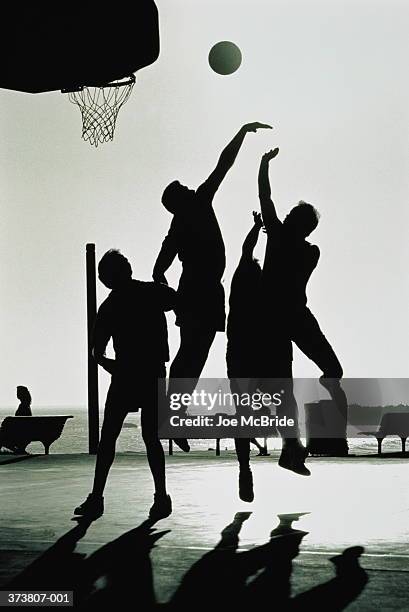 basketball, small group playing beside beach (b&w) - black and white basketball court stock pictures, royalty-free photos & images