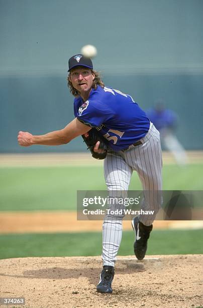 Pitcher Randy Johnson of the Arizona Diamondbacks throws during the Spring Training game against the Chicago White Sox at the Tucson Electric Park in...