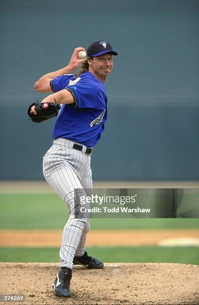Pitcher Randy Johnson of the Arizona Diamondbacks winds-back to throw during the Spring Training game against the Chicago White Sox at the Tucson...
