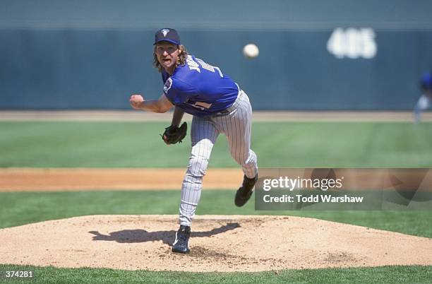 Pitcher Randy Johnson of the Arizona Diamondbacks winds-up to throw during the Spring Training game against the Chicago White Sox at the Tucson...