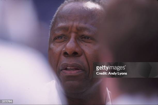 Former Atlanta Brave Hank Arron looks on during a game against the Milwaukee Brewers at Turner Field in Atlanta, Georgia. The Braves defeated the...