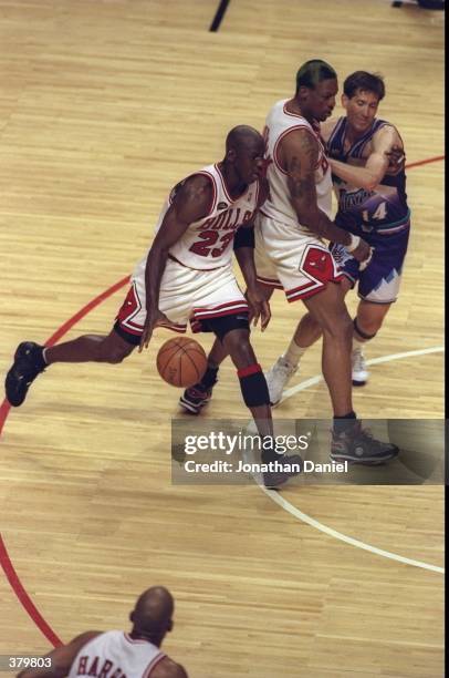 Michael Jordan and Dennis Rodman of the Chicago Bulls in action against Hornacek of the Utah Jazz during the NBA Finals Game 3 at the United Center...