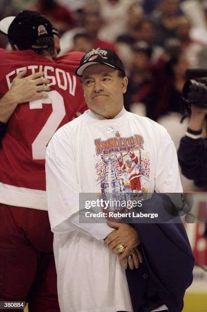 Coach Scotty Bowman of the Detroit Red Wings looks on during the Stanley Cup Finals game against the Washington Capitals at the MCI Center in...