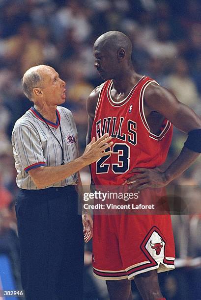 Michael Jordan of the Chicago Bulls confronts NBA Referee Dick Bavetta during the NBA Eastern Conference Finals at the Market Square Arena in...
