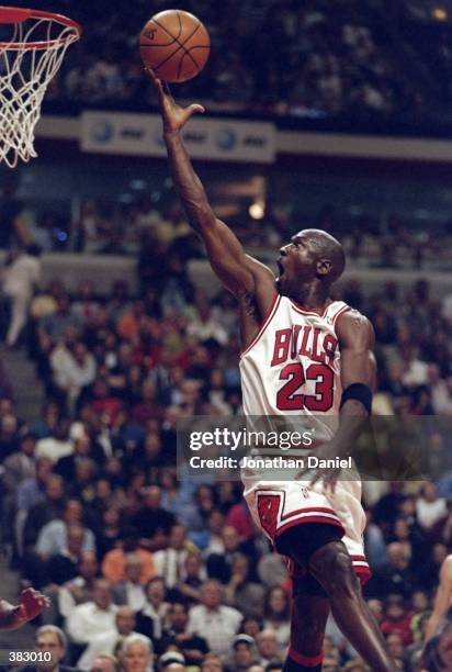 Michael Jordan of the Chicago Bulls shoots during the NBA Eastern Conference Finals at the United Center in Chicago, Illinois. The Bulls defeated the...