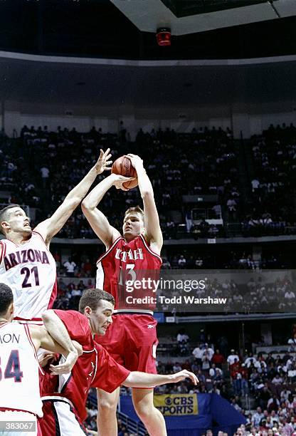 Forward Hanno Mottola of the Utah Utes in action against forward Bennett Davison of the Arizona Wildcats during an NCAA Tournament game at Arrowhead...