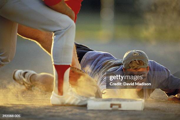 baseball, player sliding into base - softball sport stock pictures, royalty-free photos & images