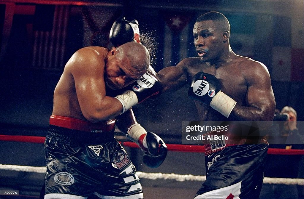 Hasim R Hasim Rahman attacking David Tua during their bout at the Miccosuree ...