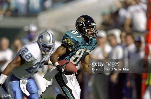 Wide receiver Keenan McCardell of the Jacksonville Jaguars in action against safety Ron Rice of the Detroit Lions during a game at Alltel Stadium in...