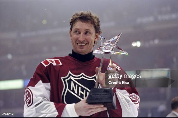 Wayne Gretzky of North American and the New York Rangers poses with the MVP Award after the 1999 49th NHL All-Star Game against the World on January...