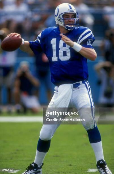 Peyton Manning of the Indianapolis Colts looks to throw during the game against the Miami Dolphins at Pro Player Stadium in Miami, Florida. The...