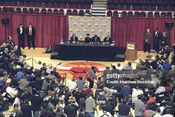 Sitting at the press conference table is the Chicago Bulls Owner Jerry Reinsdorf, Michael Jordan of the Chicago Bulls, his wife Juanita, and NBA...