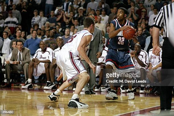 Forward Mike Babul of the UMass Minutemen in action against guard/forward Richard Hamilton of the UConn Huskies during the game at Mullins Center in...