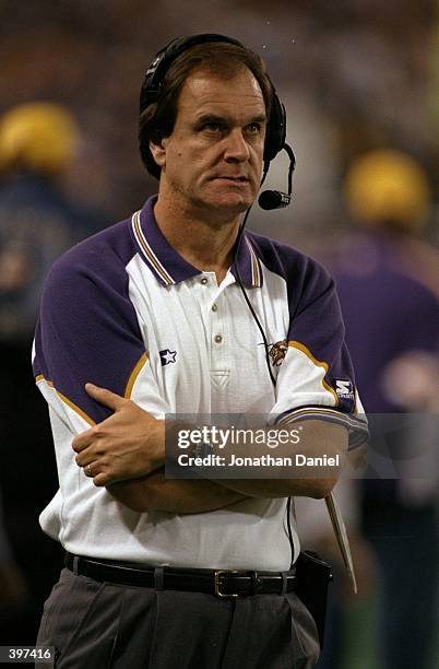 Head coach Brian Billick of the Minnesota Vikings watches from the sidelines during the NFC Championship Game against the Atlanta Falcons at HHH...