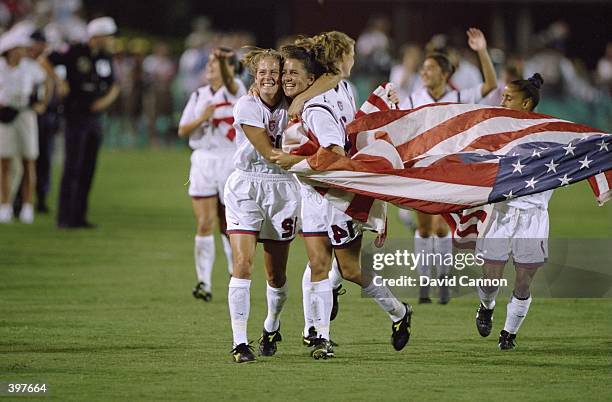 Team USA running and celebrating their win in the Women''s Soccer Finals during the 1996 Olympic Games in the Sanford Stadium in Athens, Georgia. The...