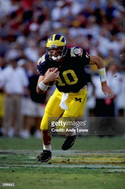Quarterback Tom Brady of the Michigan Wolverines in action during the Florida Citrus Bowl Game against the Arkansas Razorbacks at the Citrus Bowl in...