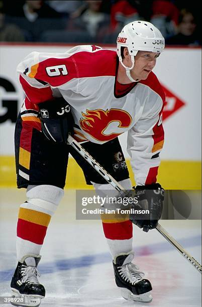 Phil Housley of the Calgary Flames waits for the puck during the game against the Philadelphia Flyers at the Canadien Airlines Saddledome in Calgary,...