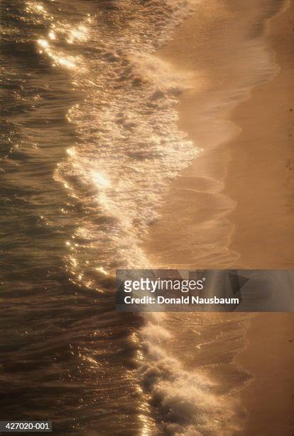 waves washing onto shore, cable beach, nassau, bahamas - cable beach bahamas stock pictures, royalty-free photos & images