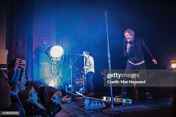Tim Foreman and Jon Foreman of Switchfoot perform on stage in front of a sold out crowd at The Moore Theater on November 15, 2013 in Seattle,...