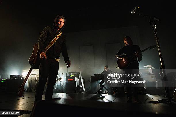Jon Foreman and Drew Shirley of Switchfoot perform on stage in front of a sold out crowd at The Moore Theater on November 15, 2013 in Seattle,...