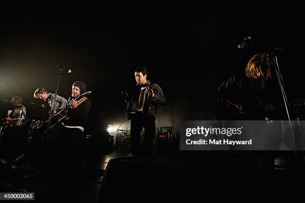 Tim Foreman, Chad Matthew Butler, Jon Foreman, Jerome Fontamillas and Drew Shirley of Switchfoot perform on stage in front of a sold out crowd at The...
