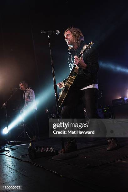 Tim Foreman and Jon Foreman of Switchfoot perform on stage in front of a sold out crowd at The Moore Theater on November 15, 2013 in Seattle,...