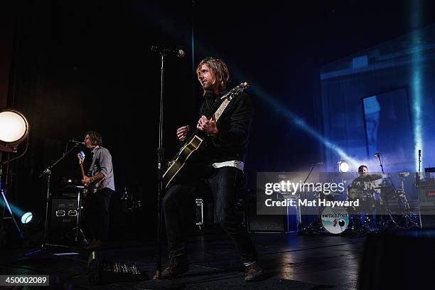 Tim Foreman , Jon Foreman and drummer Chad Matthew Butler of Switchfoot perform on stage in front of a sold out crowd at The Moore Theater on...
