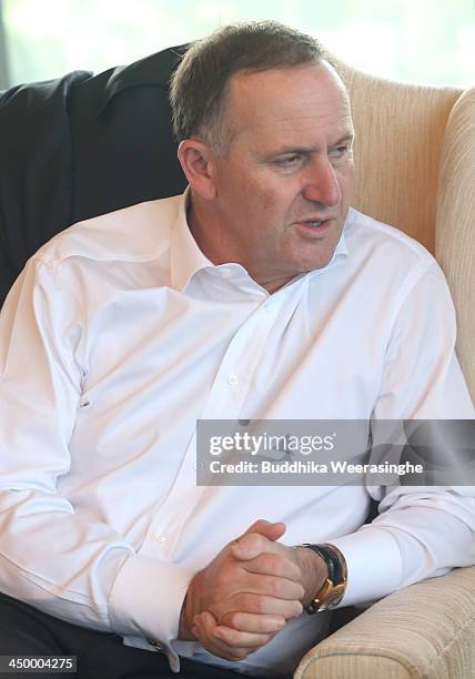 New Zealand Prime Minister John Key attends a working session of the Commonwealth Heads of Government Meeting at Waters Edge on November 16, 2013 in...