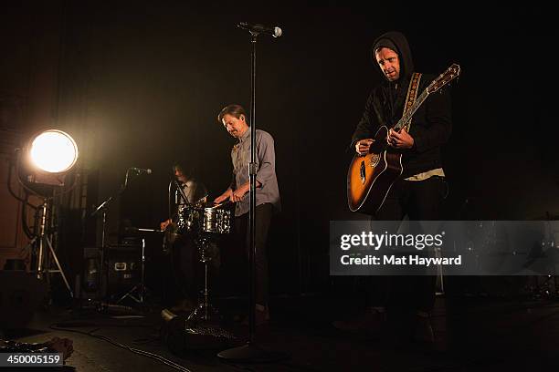 Tim Foreman, Chad Matthew Butler and Jon Foreman of Switchfoot perform on stage in front of a sold out crowd at The Moore Theater on November 15,...