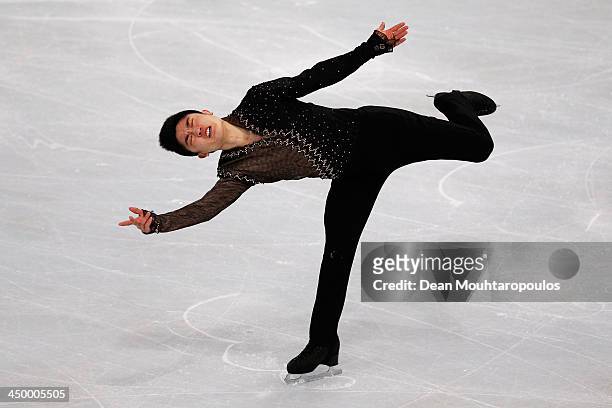 Han Yan of China performs in the Mens Short Program during day one of Trophee Eric Bompard ISU Grand Prix of Figure Skating 2013/2014 at the Palais...