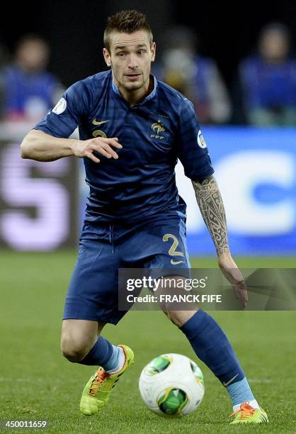 France's defender Mathieu Debuchy controls the ball during the FIFA World Cup 2014 qualifying football match Ukraine vs France on November 15, 2013...