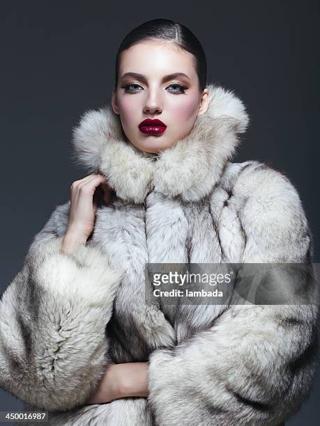beautiful woman in fur coat - fur coat stock pictures, royalty-free photos & images