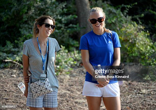 Valentina Molinari, wife of Francesco Molinari and Tennis star, Caroline Wozniacki of Denmark watching the action during the third round of the 2013...