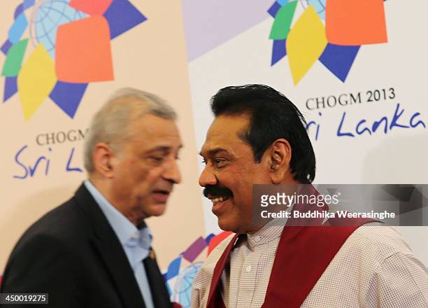 Sri Lasnkan President Mahinda Rajapaksa and Commonwealth Secretary General Kamalesh Sharma leave after addressing journalists at a press conference...