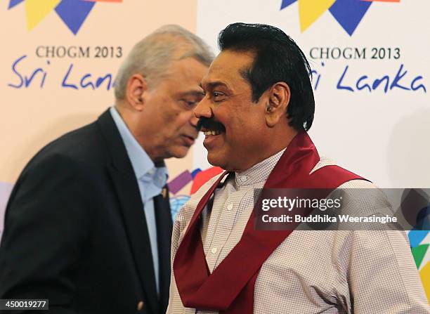 Sri Lasnkan President Mahinda Rajapaksa and Commonwealth Secretary General Kamalesh Sharma leave after addressing journalists at a press conference...