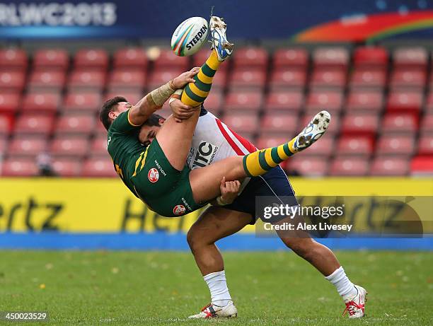 Josh Papalii of Australia is tackled by Bureta Faraimo of USA during the Rugby League World Cup Quarter Final match between Australia and USA at...