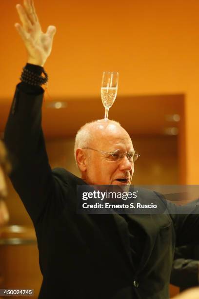 Artistic Director Marco Muller poses with a glass of wine on his head Takashi Miike meets the audience during the 8th Rome Film Festival at the...