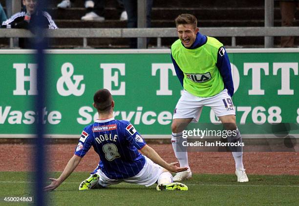 Liam Noble of Carlisle United celebrates with sub David Symington after he scored the first goal from the penalty spot during the Sky Bet League one...