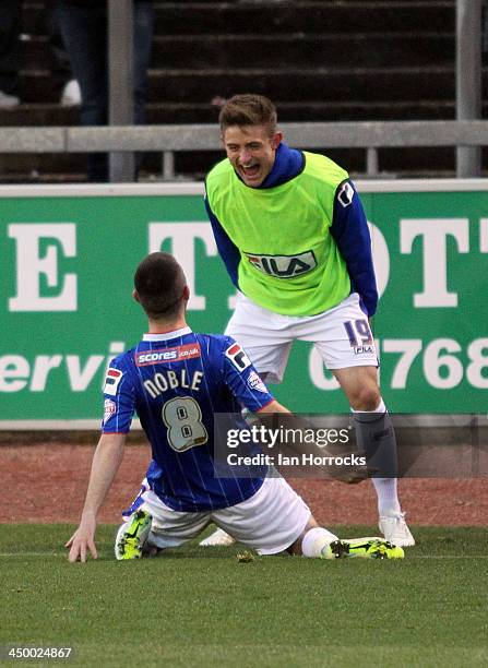Liam Noble of Carlisle United celebrates with sub David Symington after he scored the first goal from the penalty spot during the Sky Bet League one...