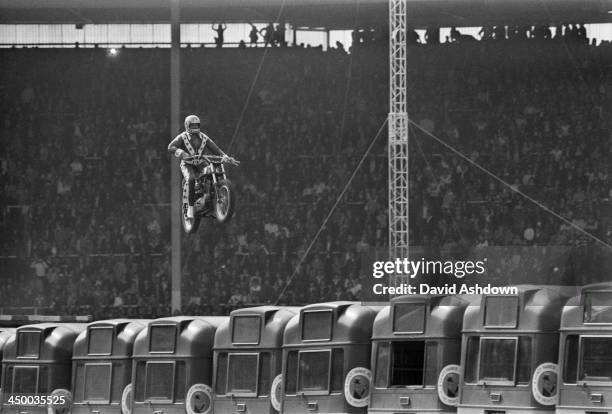 American motorcycle stunt rider Evel Knievel attempts to jump 13 AEC Merlin buses at Wembley Stadium, London, 26th May 1975. Knievel crashed his...