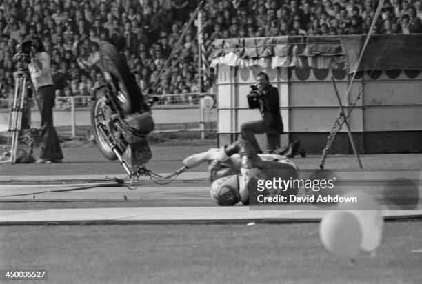 American motorcycle stunt rider Evel Knievel crashes on landing after jumping 13 AEC Merlin buses at Wembley Stadium, London, 26th May 1975. After...